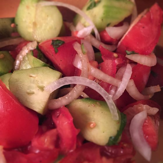 Tomato, cucumber, onion, basil salad. Perfect side dish to add a little freshness to any meal!