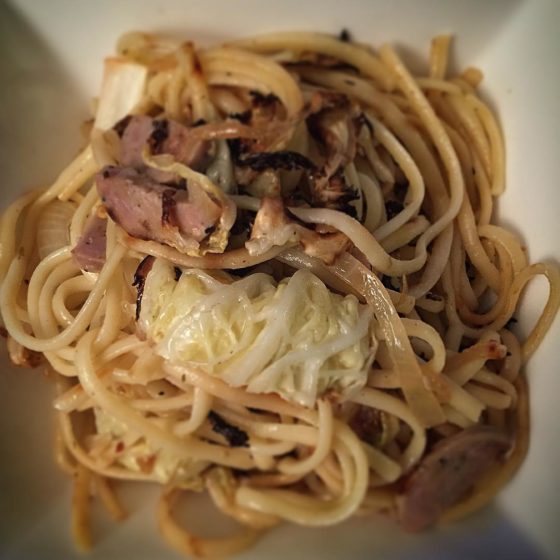 On the menu tonight: roasted cabbage, caramelized onion, and sausage linguine.
