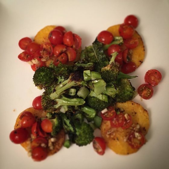 On the menu tonight: Oven baked polenta rounds topped with balsamic tomatoes served with roasted broccoli.