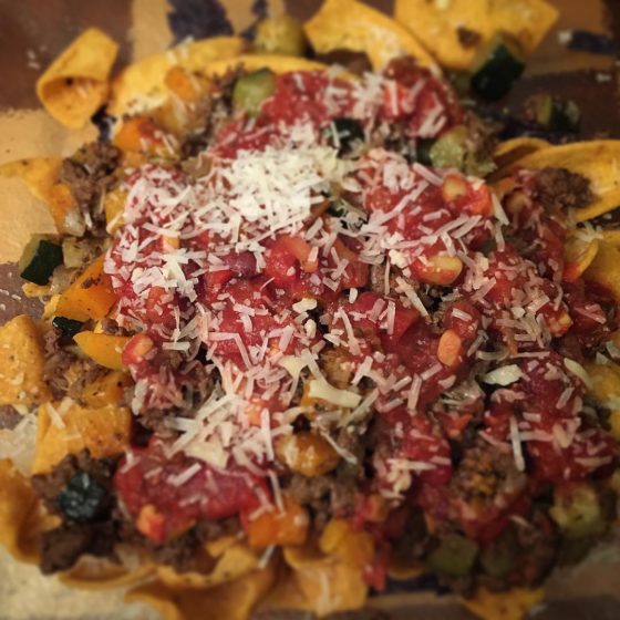 Butternut squash and zucchini taco nachos. That's right...deliciousness on a plate topped with mango cheese and black bean and corn salsa.