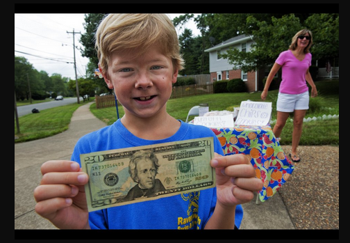 8-Year Old Johnny Garlinchak is all smiles. Can you gues why? Photo via Huffington Post